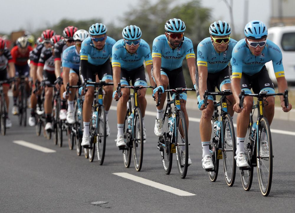 The Astana team ride to protect
