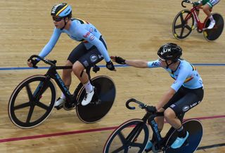 Belgium's Lotte Kopecky (L) and Jolien D'Hoore sling each other during the women's madison final at the Hong Kong Velodrome during the Track Cycling World Championships
