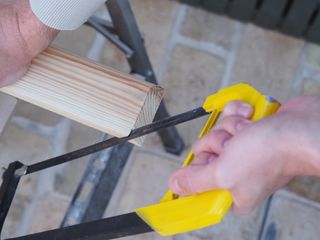 cutting a skirting board with a saw