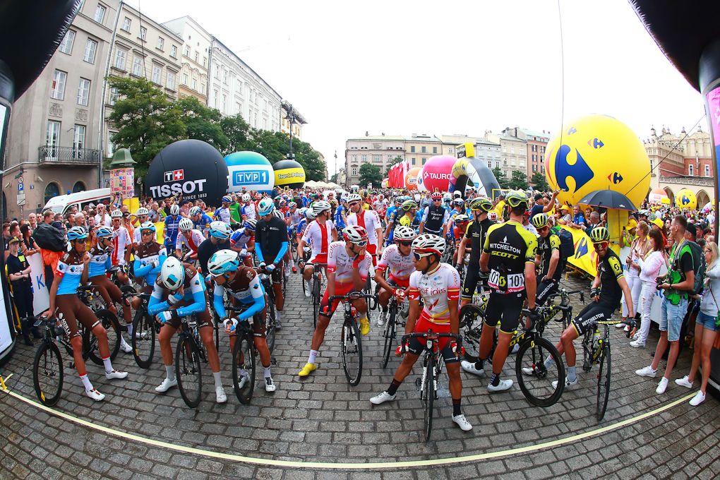 Riders wait for the start of stage 1 in Poland