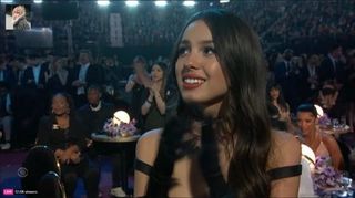 Olivia Rodrigo clapping at Grammys