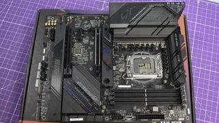 An Asus motherboard on a desk
