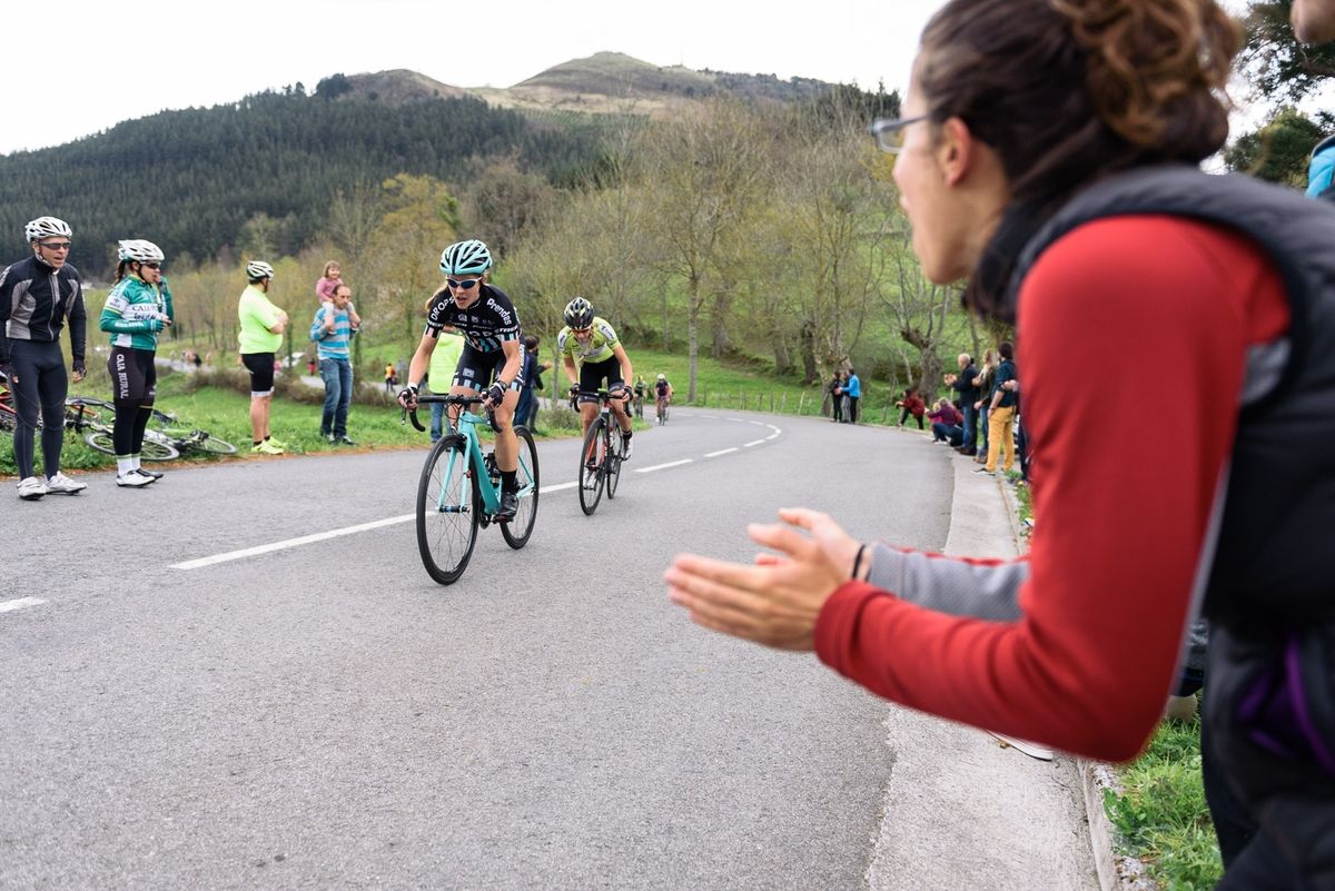 Fans cheering encouragement from the roadside
