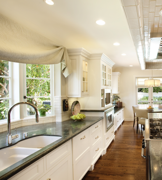 white kitchen cabinets with stone worktop