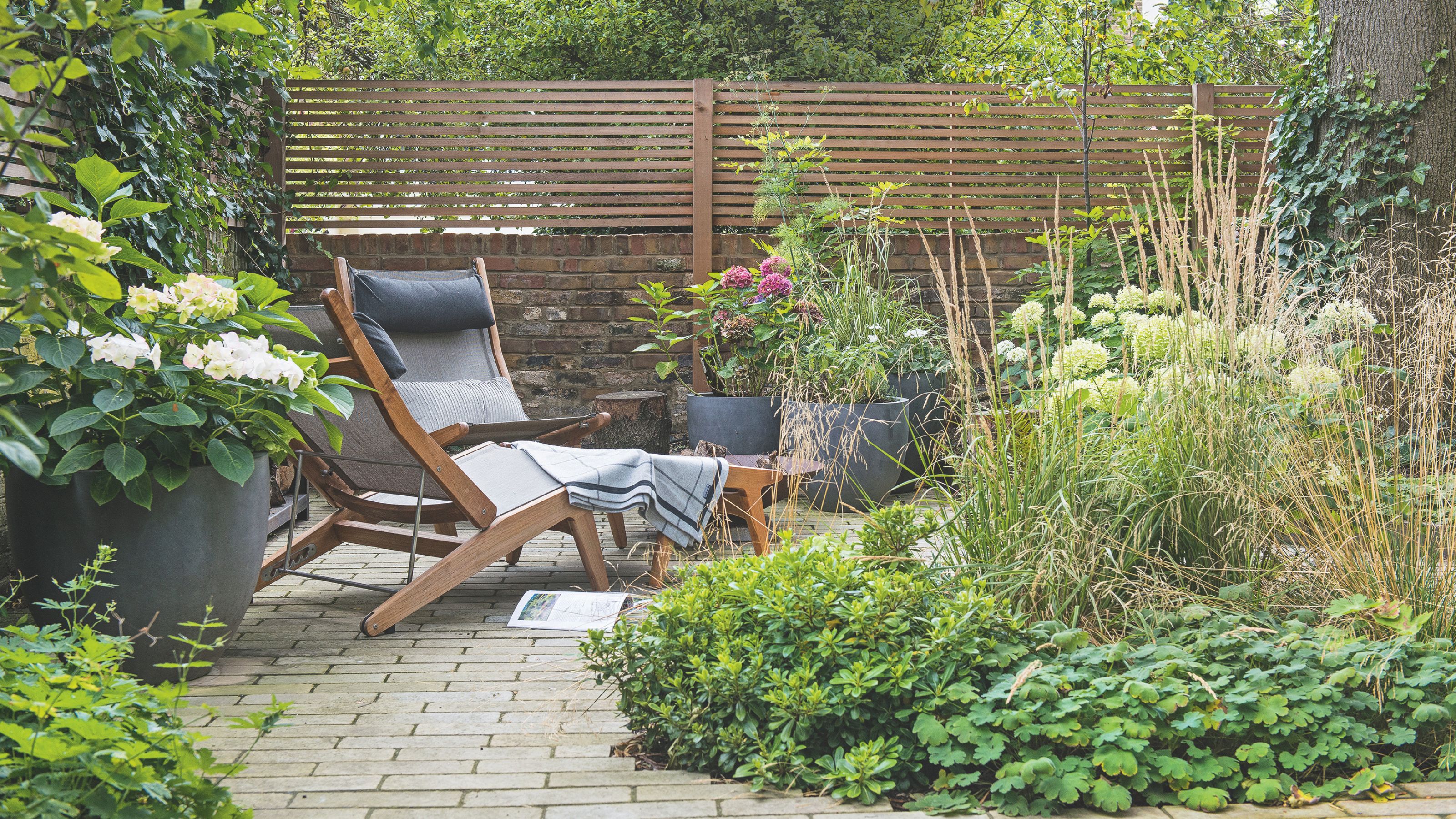 summer garden with sun lounger