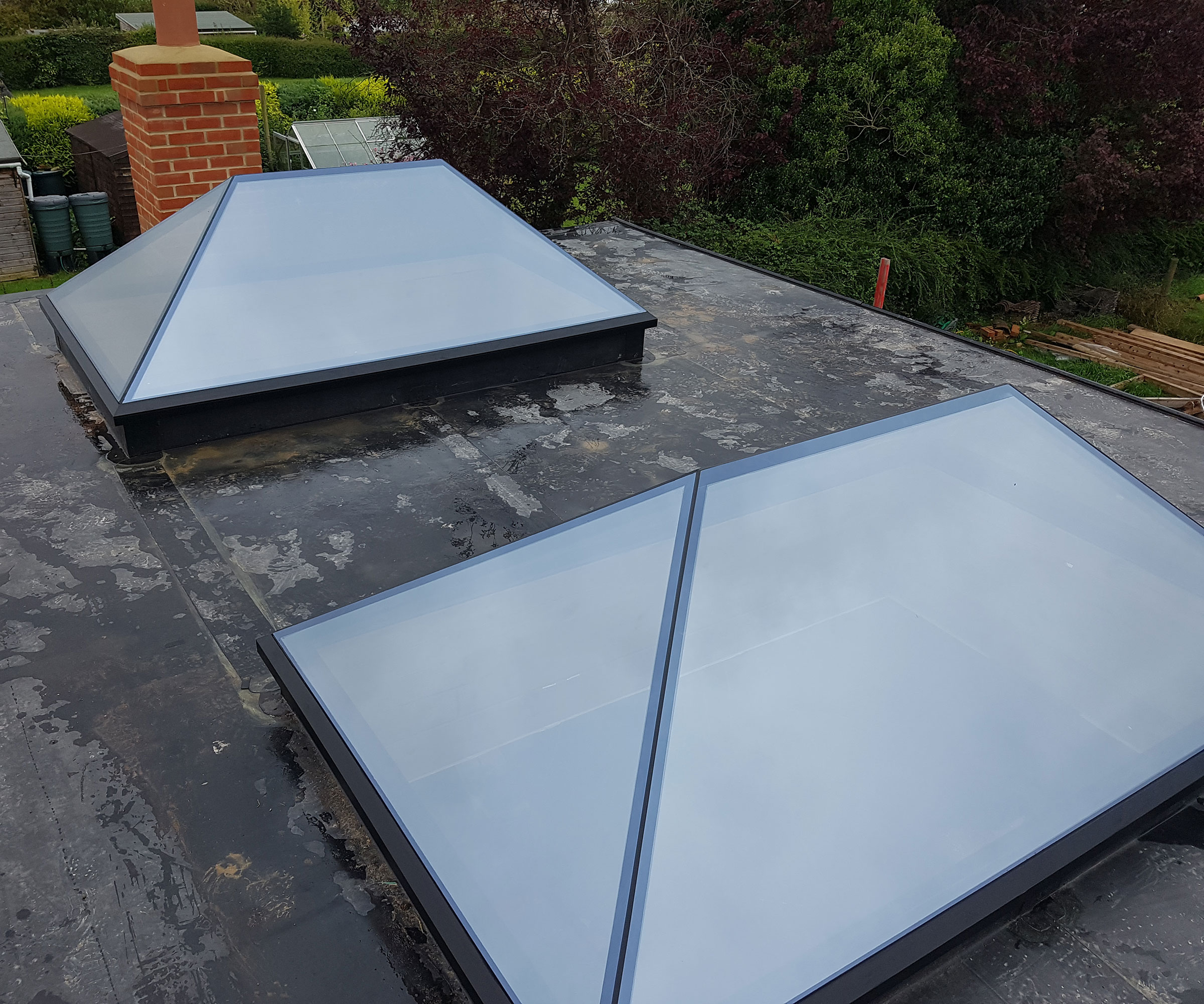 pair of roof lanterns on a flat roof