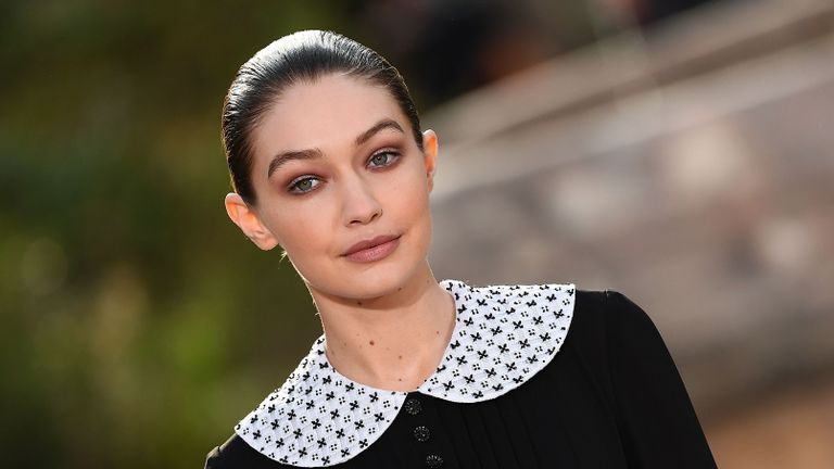 us model gigi hadid presents a creation by chanel during the womens spring summer 20202021 haute couture collection fashion show at the grand palais in paris, on january 21, 2020 the grand palais was turned into the garden of the cistercian abbey in aubazine, central france, where gabrielle coco chanel grew up photo by christophe archambault afp photo by christophe archambaultafp via getty images