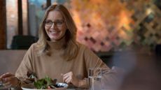 Woman eating lunch with glass of water