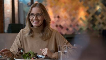 Woman eating lunch with glass of water