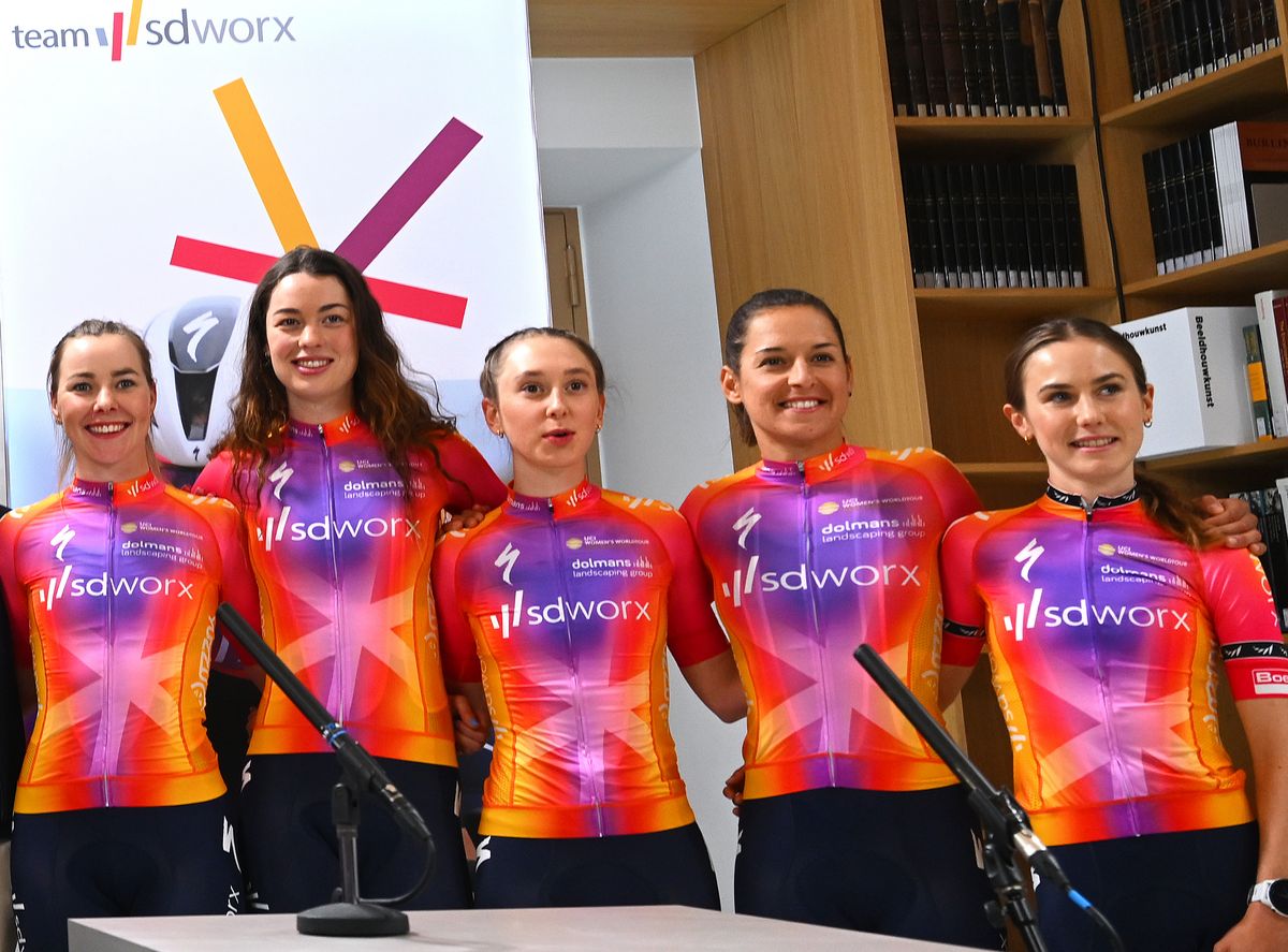 ANTWERP, BELGIUM - JANUARY 17: (L-R) Danny Stam of The Netherlands Team Manager, Lotte Kopecky of Belgium, Christine Majerus of Luxembourg, Lonneke Uneken of Netherlands, Lorena Wiebes of Netherlands, Elena Cecchini of Italy, Demi Vollering of Netherlands, Chantal van den Broek-Blaak of Netherlands, Femke Markus of Netherland, Mischa Bredewold of Netherlands, Anna Shackley of The United Kingdom, Barbara Guarischi of Italy and Niamh Fisher-Black of New-Zealand during the Team SD Worx 2023 - Team Presentation on January 17, 2023 in Antwerp, Belgium. (Photo by Luc Claessen/Getty Images)