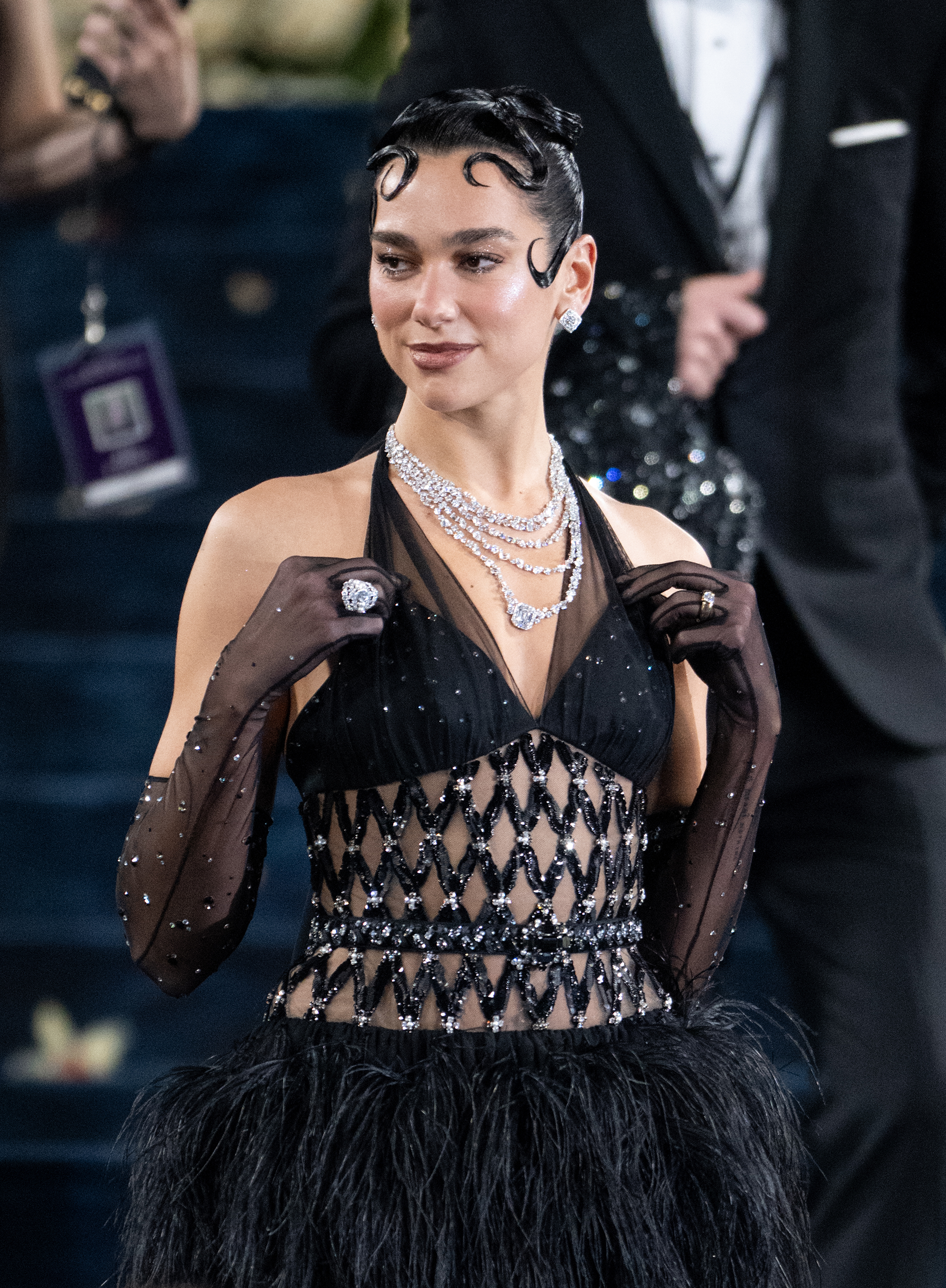 Dua Lipa sports her engagement ring at the 2025 Met Gala.