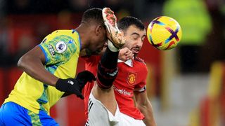 Willy Boly of Nottingham Forest caught by a high kick from Bruno Fernandes of Manchester United ahead of the Carabao Cup showdown between Manchester United and Nottingham Forest
