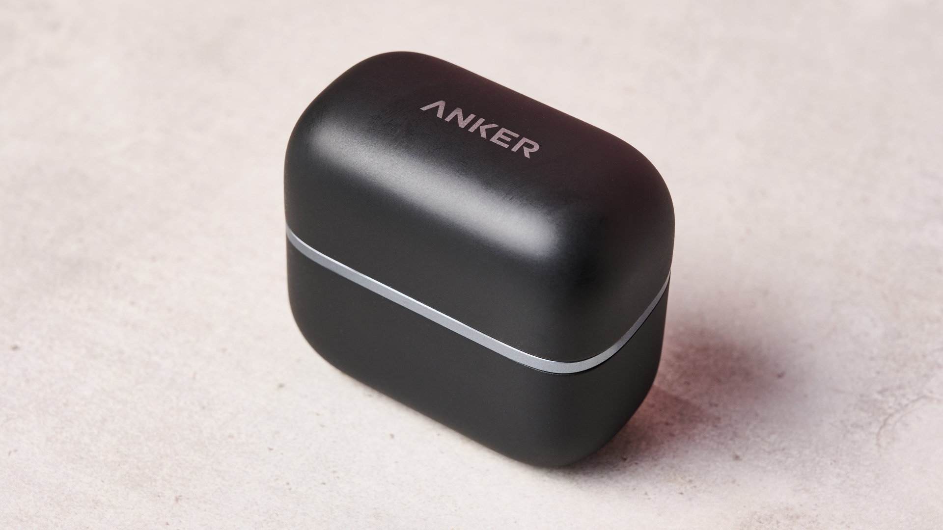 Anker logo on top of the Anker Soundcore AeroClip 2 charging case