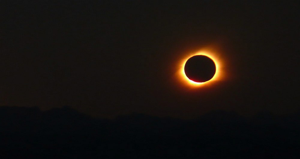 Photo of 2010’s total solar eclipse setting behind the Andes mountains. 