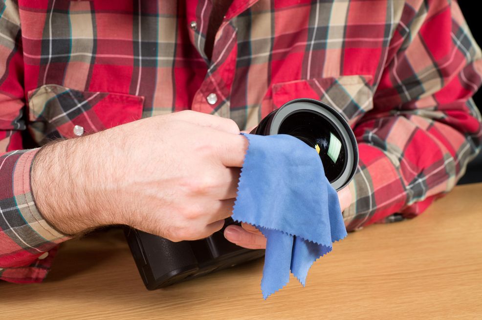 Cleaning a camera lens tips for removing dust and fingerprints