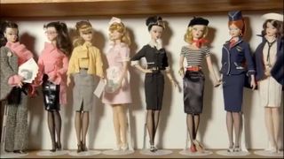 Still from The Toys That Made Us showing multiple Barbie models on a shelf