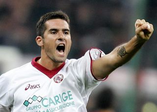 Cristiano Lucarelli celebrates after scoring for Livorno against AC Milan in 2004.