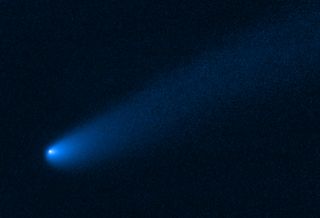 This image, captured by the Hubble Space Telescope, shows the comet P/2019 LD2 as it swoops closely to the Trojans, the ancient asteroids trapped near Jupiter by the planet's gravitational pull. This is the first comet that astronomers have observed near these ancient asteroids and the image reveals the comet's dust and gas tail trailing away from its glowing center (or nucleus). The comet was discovered in June 2019 and is likely among the comets journeying towards the Sun after escaping the Kuiper belt.