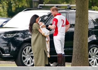 Harry and Meghan fuss over Archie Harrison at a polo game 2 months after his birthday.