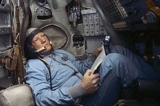 Cosmonaut Igor Volk training in a Soyuz simulator.