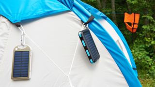 5 reasons you need a solar charger: chargers on a tent