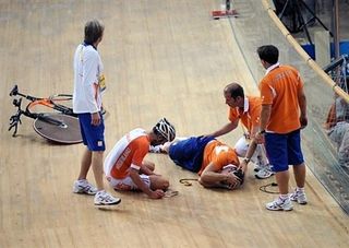 Levi Heimans (Netherlands) stays on the ground after crashing into his head