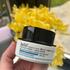 a hand holding belif aqua bomb