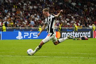 Sean Longstaff of Newcastle United FC shoots the ball during the UEFA Champions League Group F match between AC Milan and Newcastle United FC at Stadio Giuseppe Meazza on September 19, 2023 in Milan, Italy.
