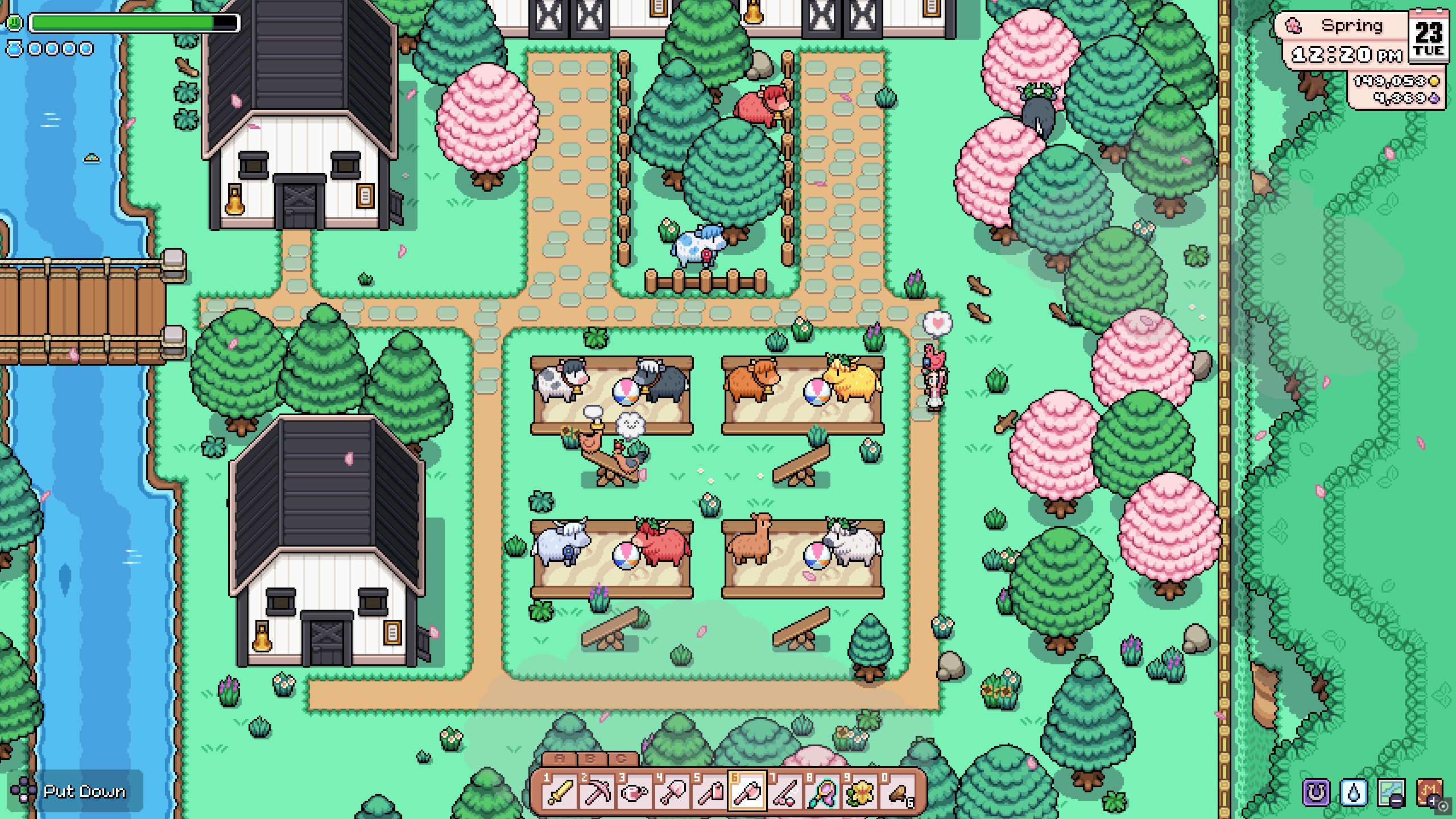 Fields of Mistria - A player holds a chicken on their farm while cows play nearby outside the barns.