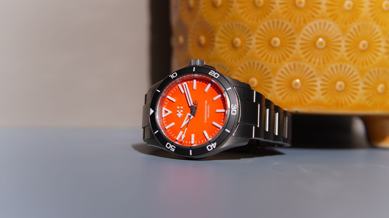 The Christopher Ward C60 Trident Lumiere against a yellow pot