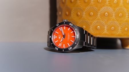 The Christopher Ward C60 Trident Lumiere against a yellow pot