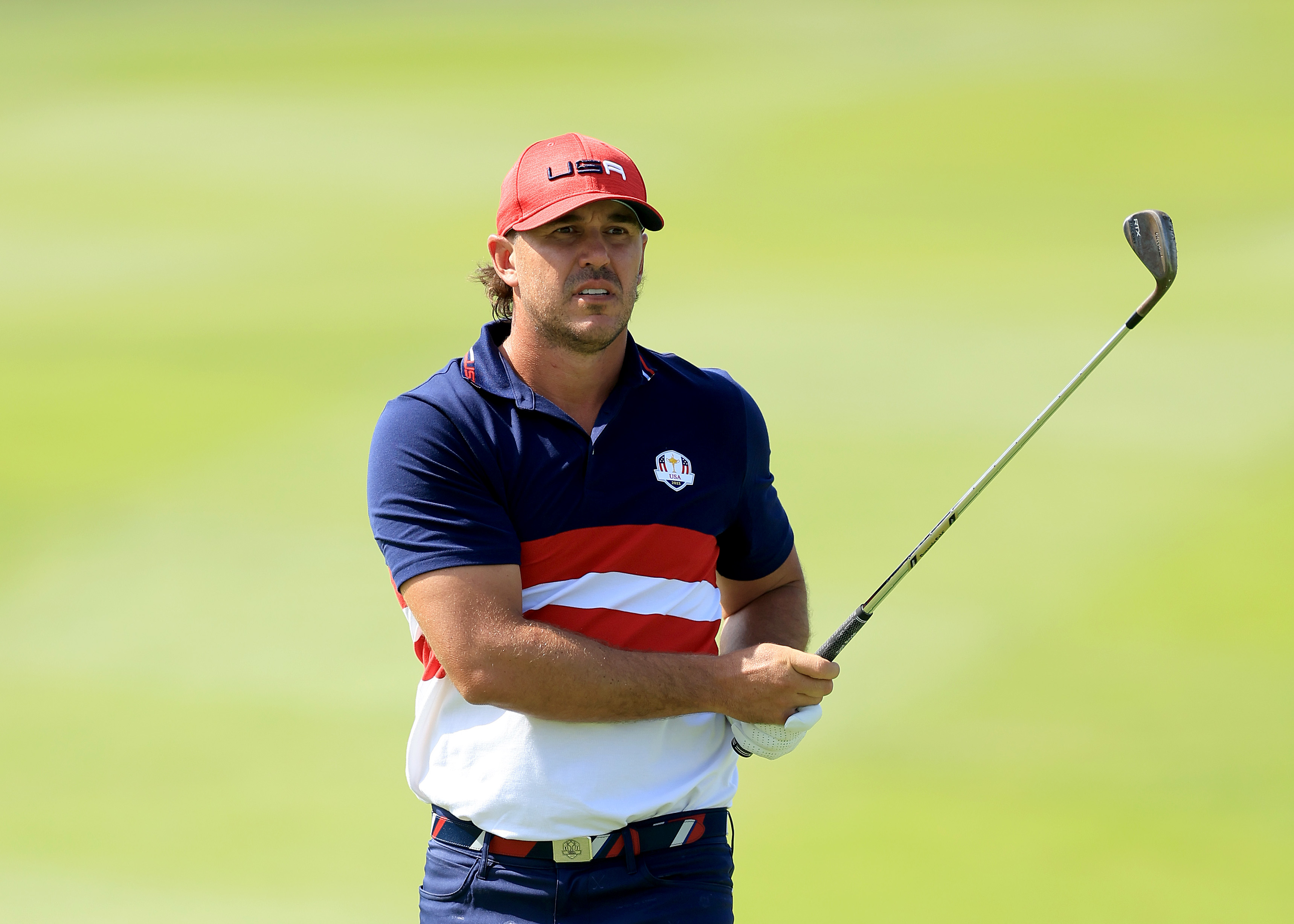Brooks Koepka hits a wedge shot