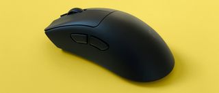 A Razer DeathAdder V3 HyperSpeed mouse against a yellow background.