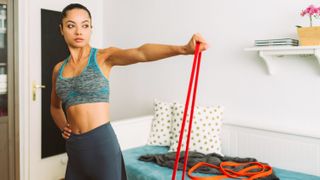 a photo of a woman working out with a resistance band