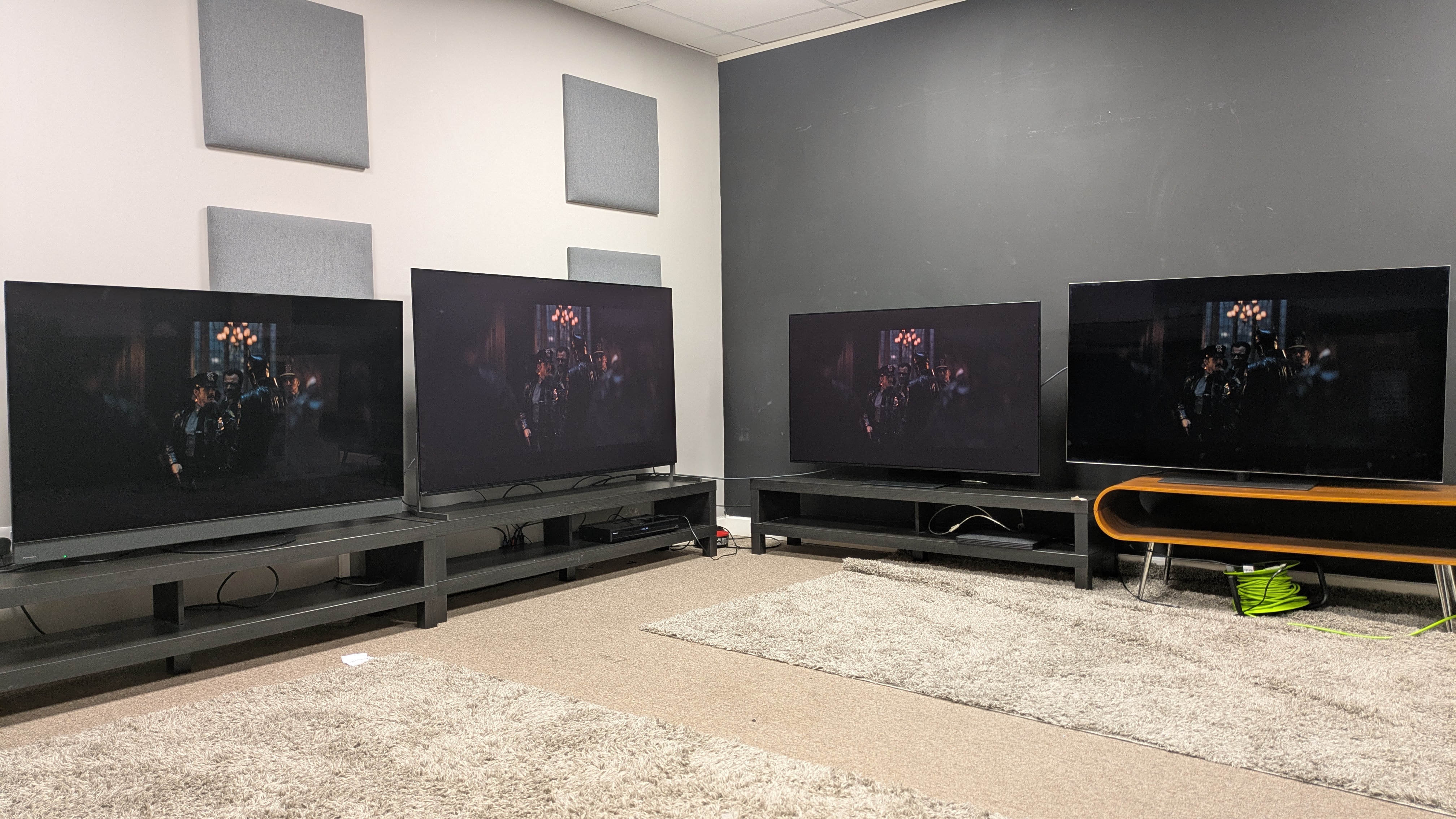 Panasonic Z95B (far left) Sony Bravia 8 II (middle left) Samsung S95F (middle right) and LG G5 (far right) with The Batman on screen in a bright room