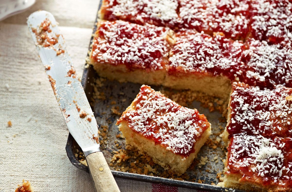 Have a go at making these jammy coconut square complete with surprise ingredient