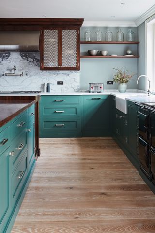 how to choose kitchen flooring wood floor in green and marble kitchen by Naked Kitchens
