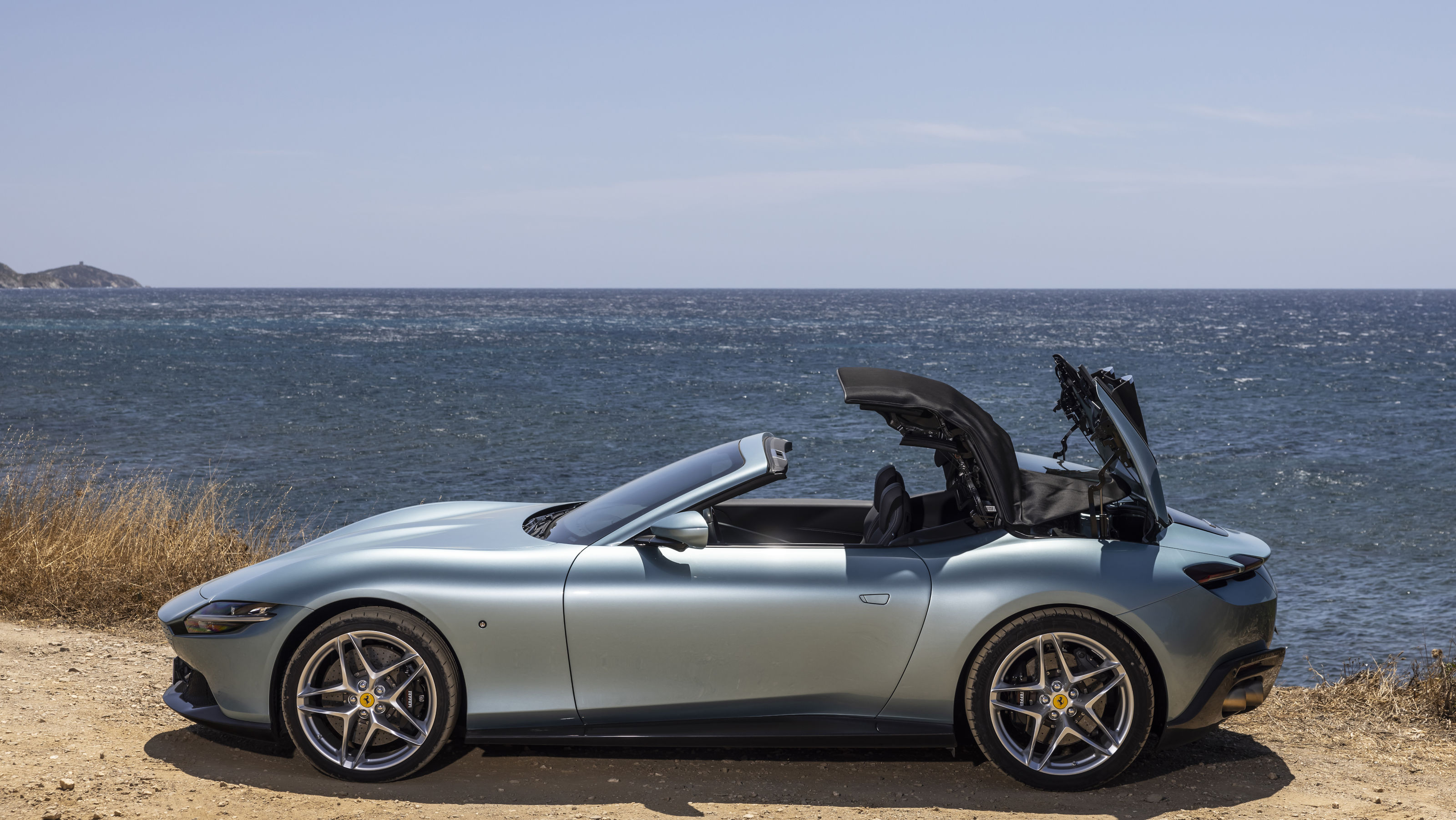 Ferrari Roma Spider with soft top half open