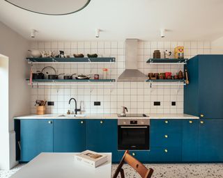 charles holland designed house's kitchen in blue