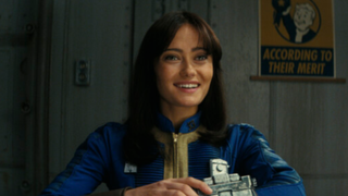 Lucy smiling while using her pip boy