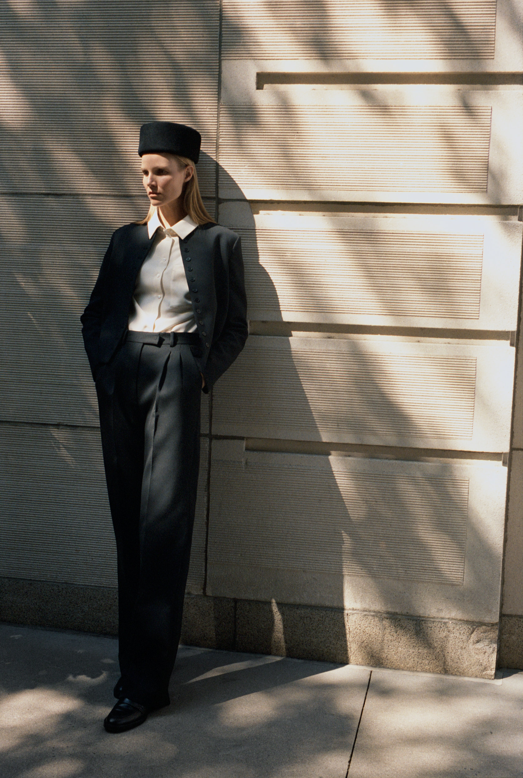 a model poses for an almada label campaign