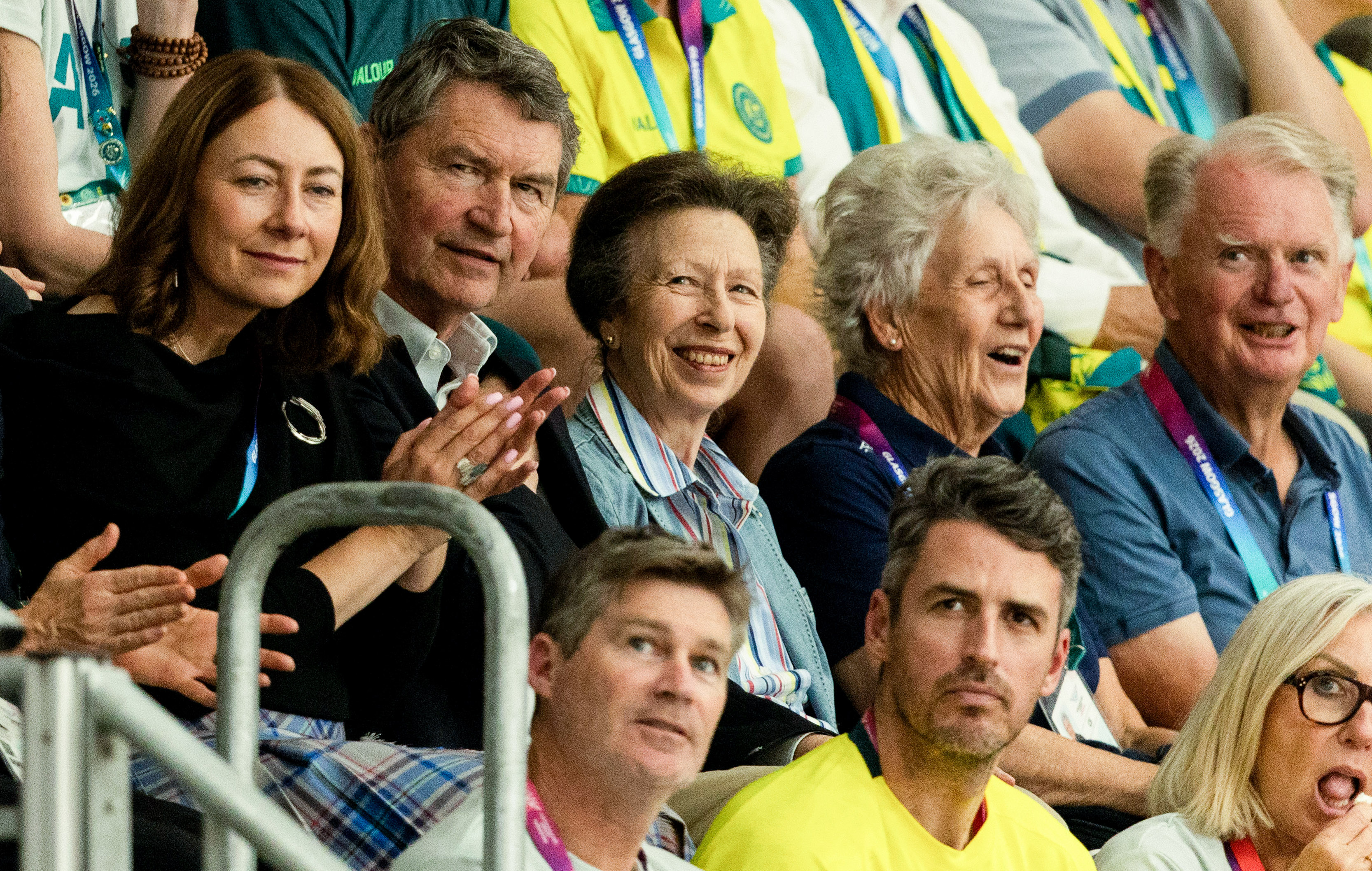 Princess Anne smiling in the stands at the Commonwealth Games