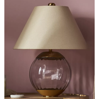 table lamp with beige linen shade and glass and gold base