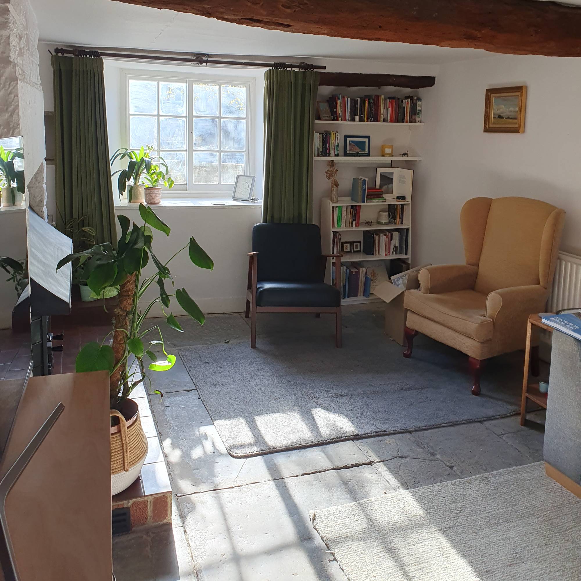 white living room in cottage with flagstones