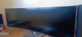 A Dell UltraSharp U4924DW monitor sitting on a desk