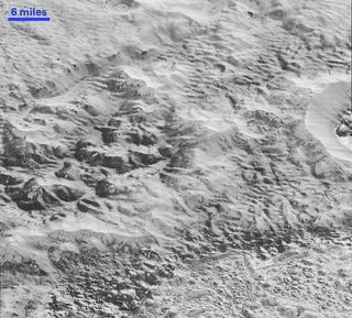 This highest-resolution image from NASA’s New Horizons spacecraft shows how erosion and faulting on Pluto have shaped the icy crust of the planet into rugged badlands topography.