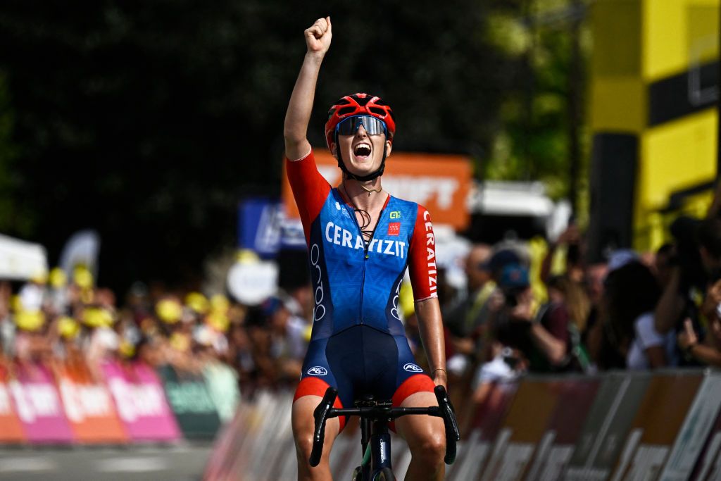 Ceratizit - WNT Pro Cycling Team's French rider Cedrine Kerbaol celebrates as she crosses the finish line to win the 6th stage (out of 8) of the third edition of the Women's Tour de France cycling race, a 159.2 km between Remiremont and Morteau, eastern France, on August 16, 2024. (Photo by JULIEN DE ROSA / AFP)