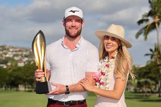 Grayson Murray and his fiancee with the Sony Open trophy