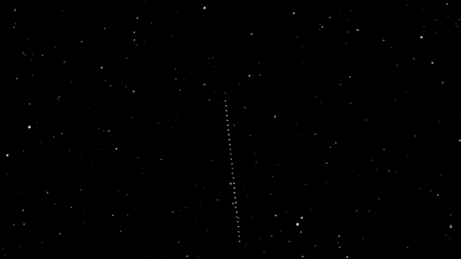 A line of white dots against a dark background