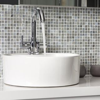 bathroom with washbasin and mosaic tiles